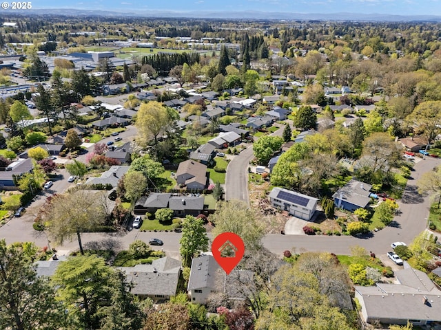 aerial view of property's location with nearby suburban area