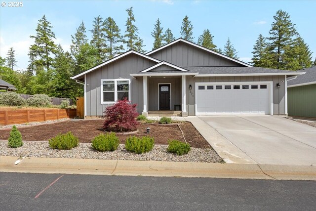371 Cedar, Cave Junction, OR 97523 - single story home with an attached garage, driveway, and board and batten siding