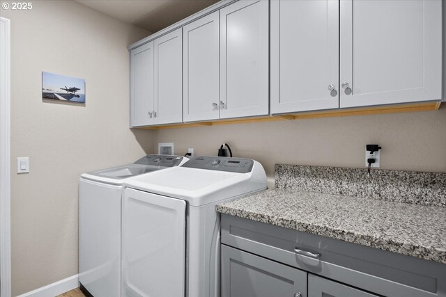 371 Cedar, Cave Junction, OR 97523 - washroom with cabinet space, independent washer and dryer, and baseboards