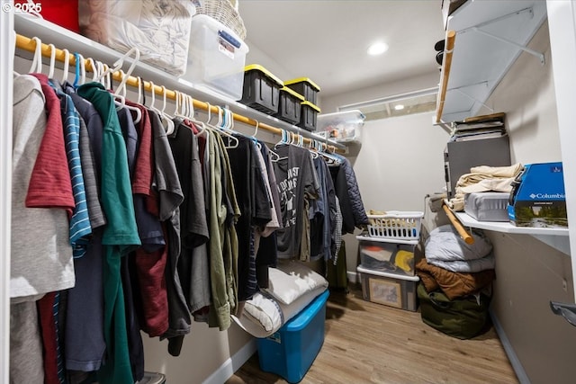 spacious closet featuring wood finished floors
