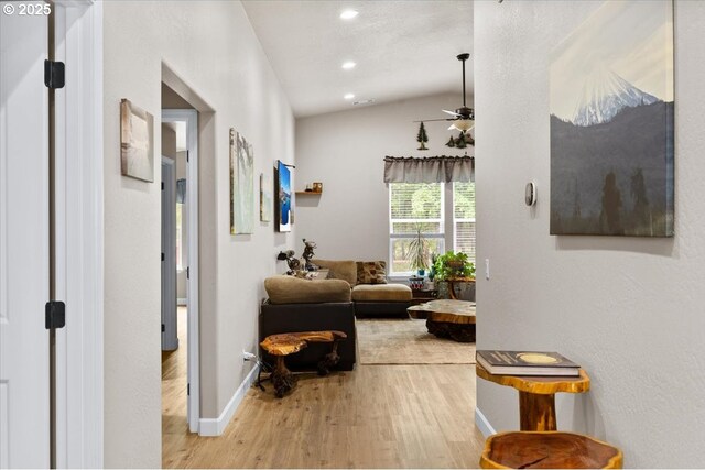 371 Cedar, Cave Junction, OR 97523 - hallway with wood finished floors, vaulted ceiling, baseboards, and recessed lighting