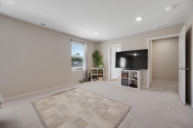 4829 Surveyor Ave, Salem, OR 97305 - living area with carpet, a textured ceiling, baseboards, and recessed lighting