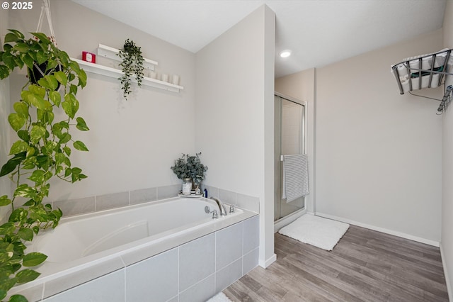 4829 Surveyor Ave, Salem, OR 97305 - bathroom with a garden tub, a stall shower, wood finished floors, baseboards, and recessed lighting