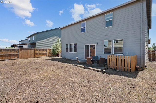 4829 Surveyor Ave, Salem, OR 97305 - rear view of house featuring a fenced backyard and a patio area