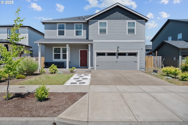4829 Surveyor Ave, Salem, OR 97305 - traditional home with a porch, driveway, board and batten siding, an attached garage, and roof with shingles