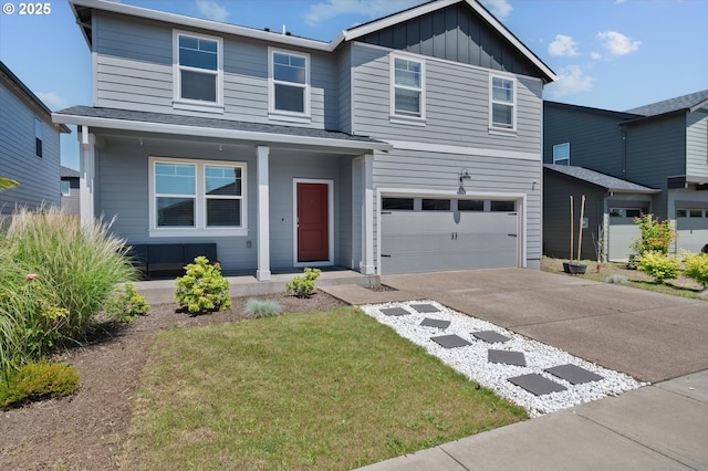 4829 Surveyor Ave, Salem, OR 97305 - traditional-style house with covered porch, driveway, board and batten siding, an attached garage, and a front lawn