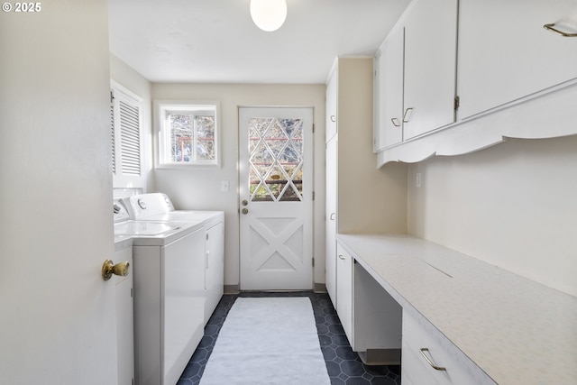 laundry area featuring cabinets and independent washer and dryer