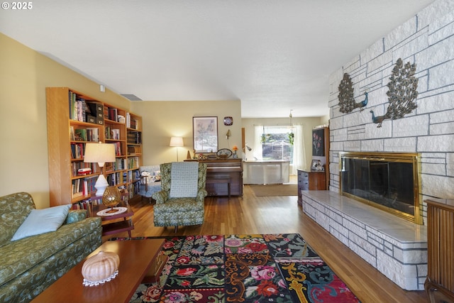 living room featuring hardwood / wood-style flooring and a fireplace