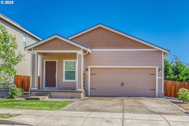1712 W 12th St, La Center, WA 98629 - view of front of home with concrete driveway and an attached garage