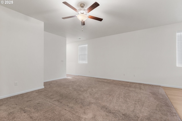 1712 W 12th St, La Center, WA 98629 - spare room with ceiling fan, baseboards, and light carpet