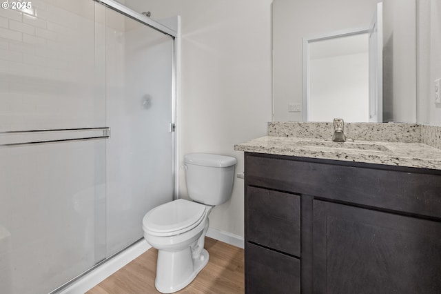 1712 W 12th St, La Center, WA 98629 - full bathroom featuring wood finished floors, a stall shower, toilet, vanity, and baseboards