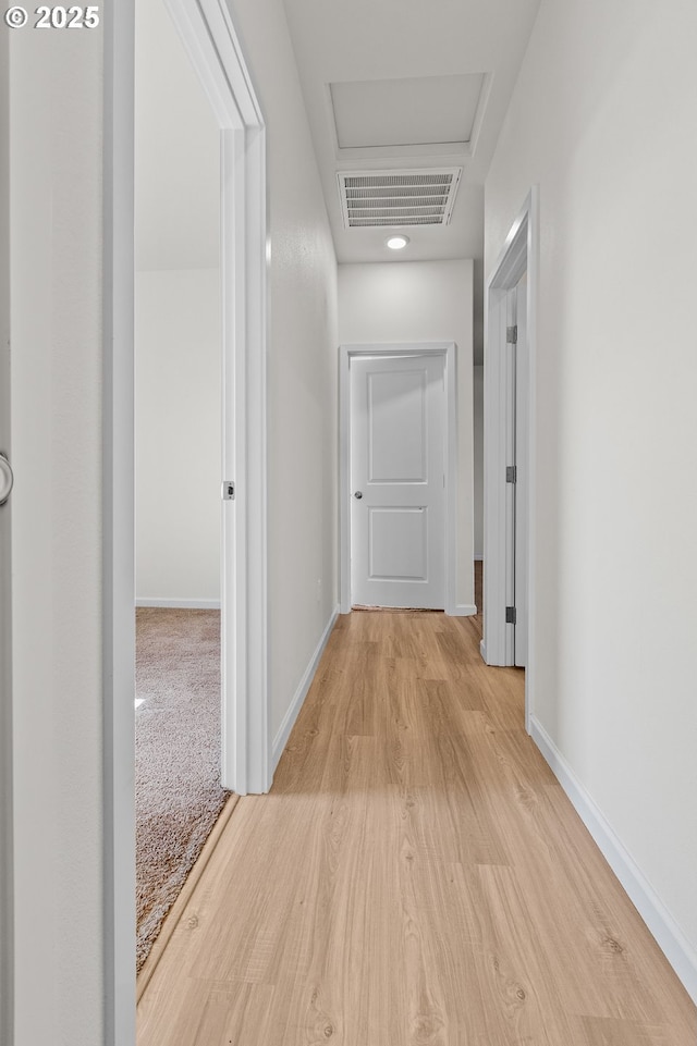 1712 W 12th St, La Center, WA 98629 - hallway with attic access, light wood-type flooring, and baseboards