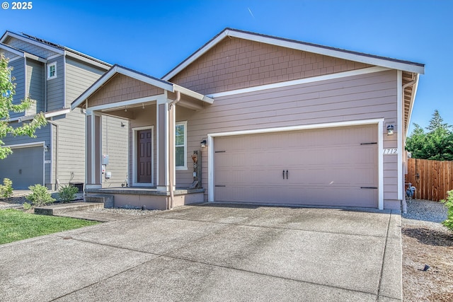 1712 W 12th St, La Center, WA 98629 - view of front of property with concrete driveway and a garage