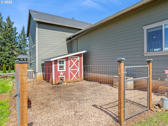 29349 SE Sunview Ln, Estacada, OR 97023 - view of side of property featuring an outdoor structure and roof with shingles