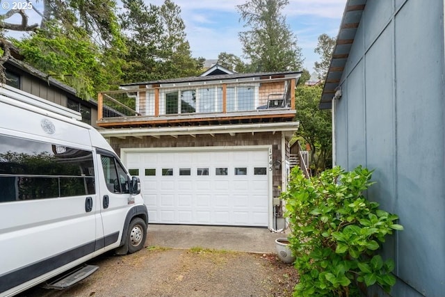 1745 Pearl St, Tillamook, OR 97141 - view of front facade featuring a balcony and asphalt driveway
