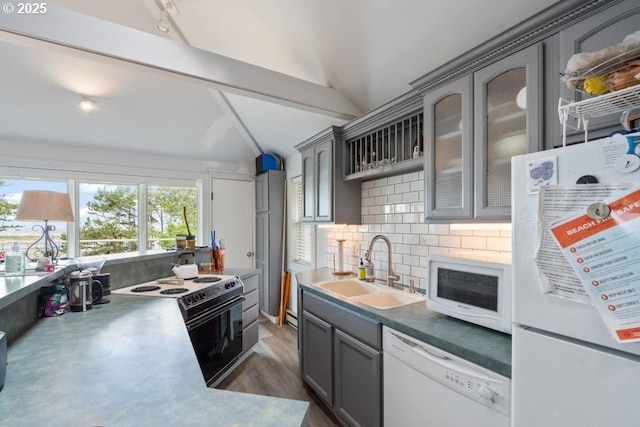 1745 Pearl St, Tillamook, OR 97141 - kitchen with white appliances, lofted ceiling, gray cabinets, a sink, and tasteful backsplash