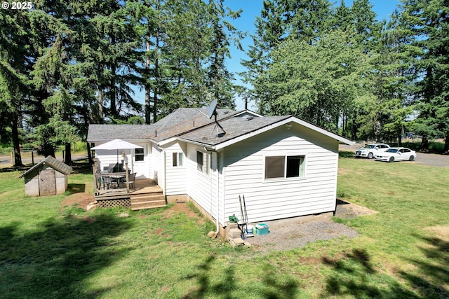 20131 Bridge Creek Rd SE, Silverton, OR 97381 - rear view of property with a deck, a yard, a storage shed, and roof with shingles