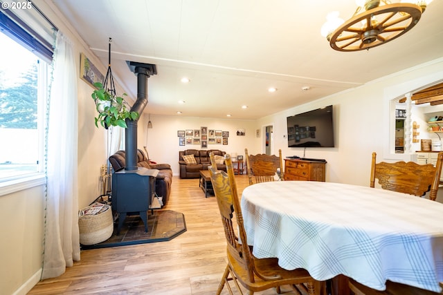 20131 Bridge Creek Rd SE, Silverton, OR 97381 - dining room with a wood stove, light wood-type flooring, a chandelier, and recessed lighting