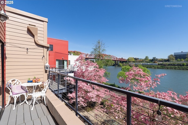 balcony featuring a water view