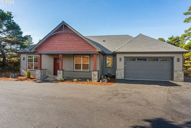 craftsman-style home with a garage and a porch