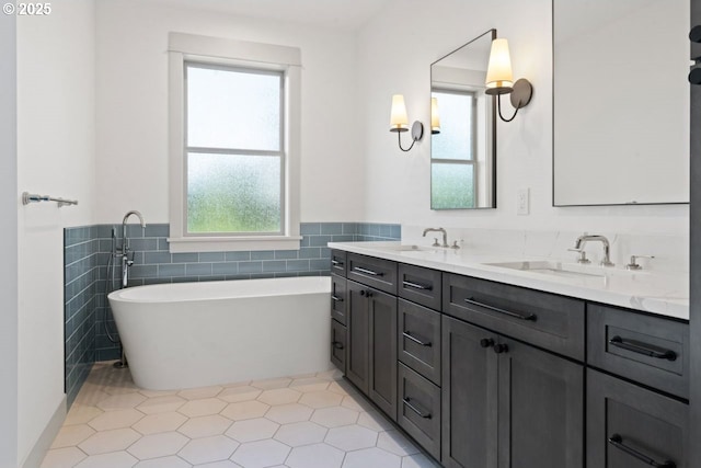 bathroom with tile walls, a bath, vanity, and tile patterned flooring