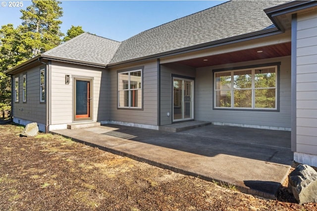 rear view of house with a patio