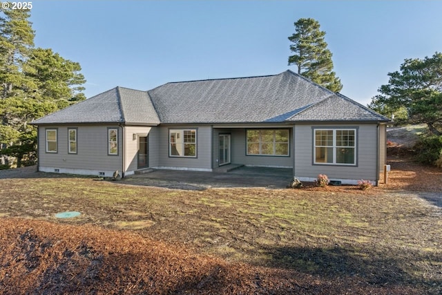 rear view of house featuring a yard and a patio