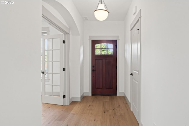 entrance foyer with light hardwood / wood-style flooring