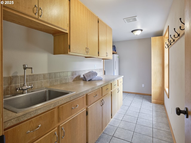 13708 NE 401st Way, Amboy, WA 98601 - kitchen with a sink, freestanding refrigerator, light tile patterned flooring, light countertops, and baseboards