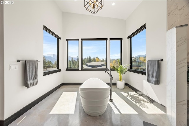 725 NW Angel Heights Rd, Stevenson, WA 98648 - interior space with recessed lighting, baseboards, a freestanding tub, and plenty of natural light