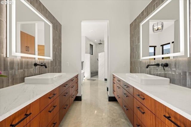 725 NW Angel Heights Rd, Stevenson, WA 98648 - bathroom with two vanities, a sink, and tasteful backsplash