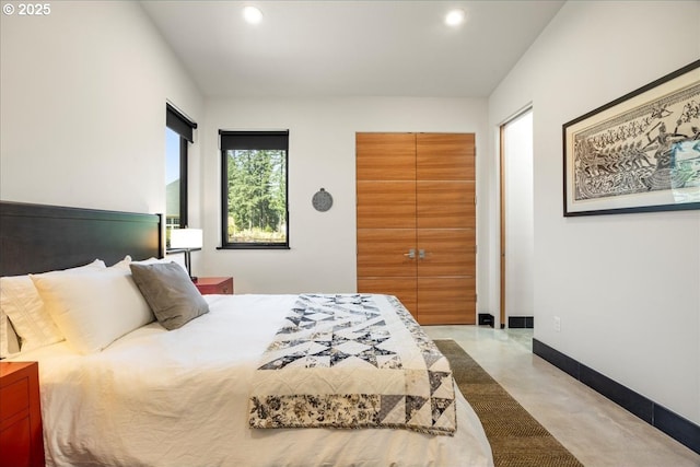 725 NW Angel Heights Rd, Stevenson, WA 98648 - bedroom with finished concrete flooring, baseboards, and recessed lighting