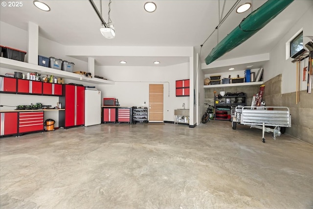 725 NW Angel Heights Rd, Stevenson, WA 98648 - garage featuring refrigerator and recessed lighting