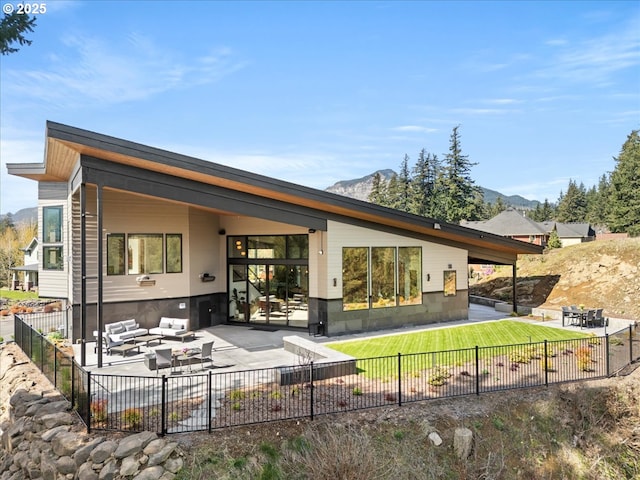 725 NW Angel Heights Rd, Stevenson, WA 98648 - back of house with a fenced backyard, a mountain view, and a patio