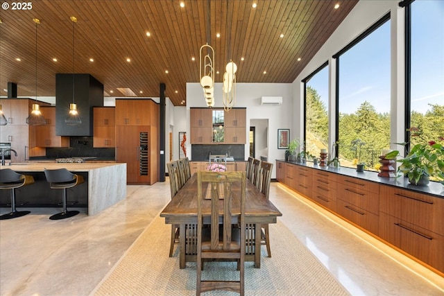 725 NW Angel Heights Rd, Stevenson, WA 98648 - dining area with wooden ceiling, an AC wall unit, concrete flooring, and recessed lighting