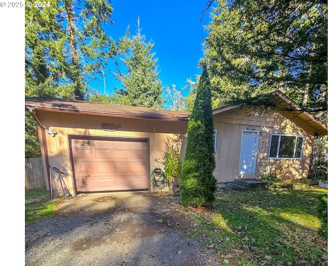 single story home featuring a garage