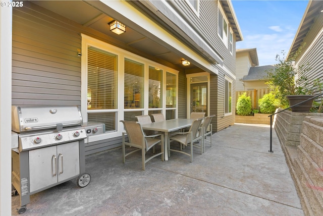 view of patio / terrace with outdoor dining space and fence