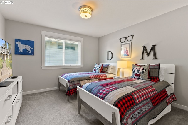 carpeted bedroom with baseboards