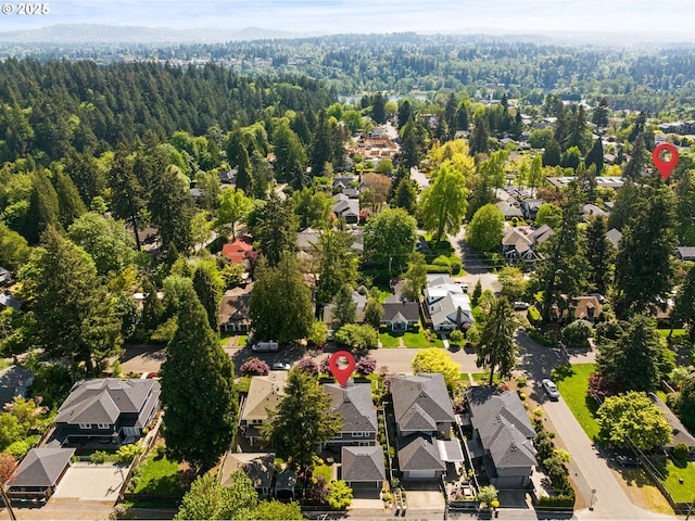 aerial view of residential area with a heavily wooded area
