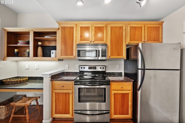 525 Springtree Ln, West Linn, OR 97068 - kitchen featuring stainless steel appliances, open shelves, dark stone countertops, and wood finished floors