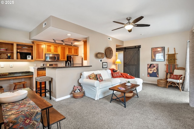 525 Springtree Ln, West Linn, OR 97068 - living area with a barn door, carpet floors, a ceiling fan, and track lighting