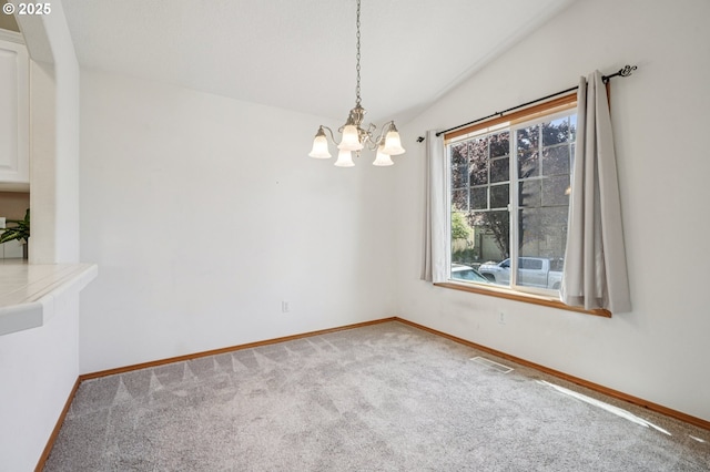 5661 J St, Washougal, WA 98671 - unfurnished dining area featuring a chandelier, baseboards, carpet, and lofted ceiling