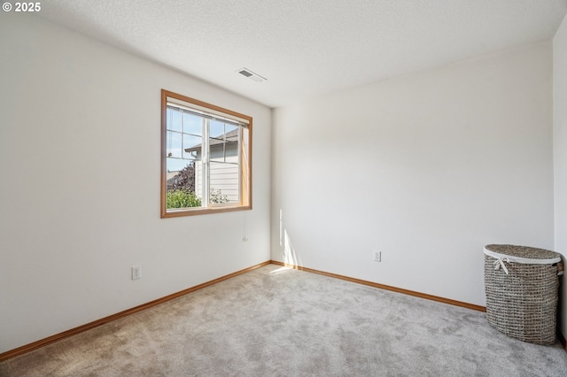 5661 J St, Washougal, WA 98671 - unfurnished room with carpet, baseboards, and a textured ceiling