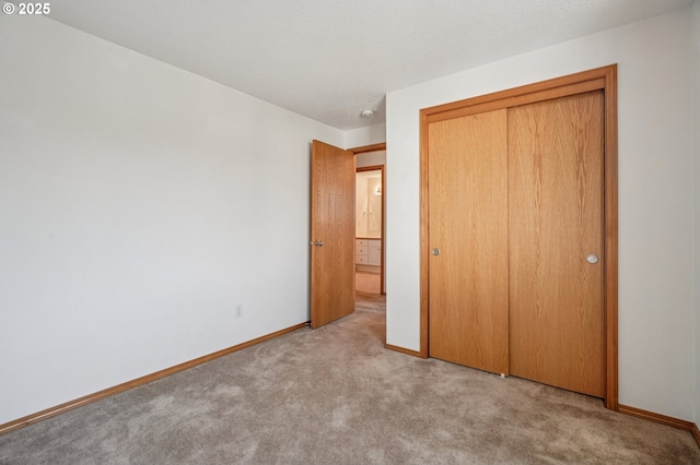 5661 J St, Washougal, WA 98671 - unfurnished bedroom featuring carpet flooring, baseboards, and a closet