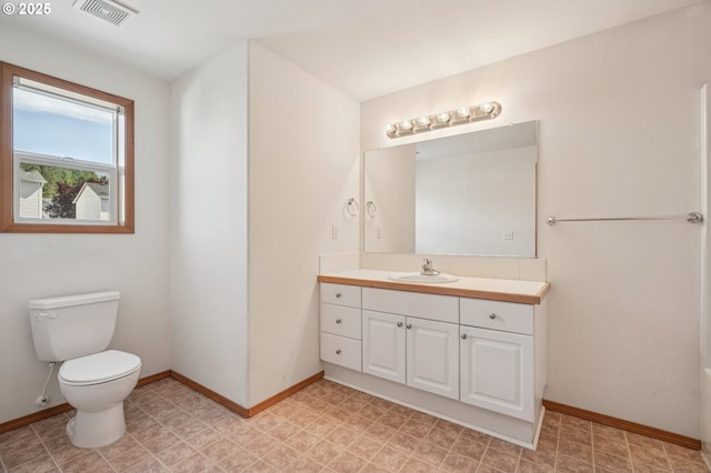 5661 J St, Washougal, WA 98671 - bathroom with vanity, toilet, and baseboards