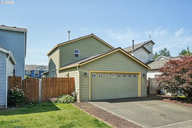 5661 J St, Washougal, WA 98671 - traditional home featuring concrete driveway and a garage