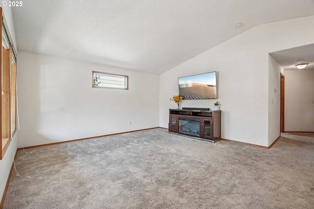 5661 J St, Washougal, WA 98671 - unfurnished living room with lofted ceiling, carpet flooring, and baseboards