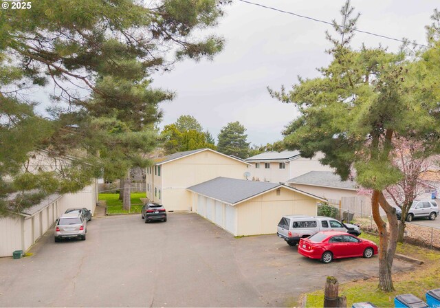 view of front of house featuring fence