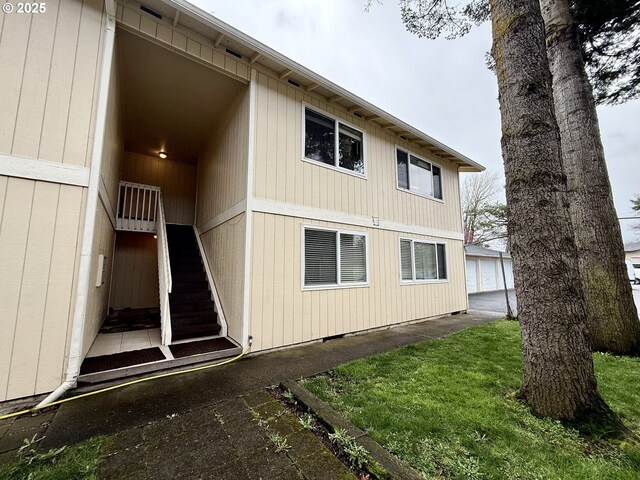 rear view of property with a lawn