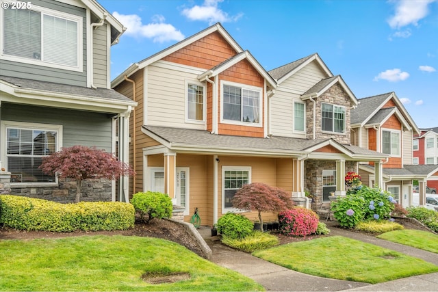 2590 NW 2nd Ter, Gresham, OR 97030 - view of front of home featuring stone siding, a porch, and a front lawn